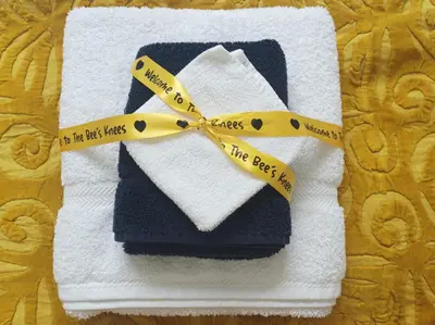 a towel with a yellow ribbon that says no the best napkin at Olde Farm Holiday Cottages in Banham