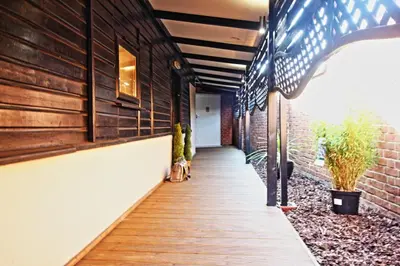 a hallway of a house with a wooden walkway at Star Apartment Ipswich, A Hidden Gem near the Waterfront in Ipswich