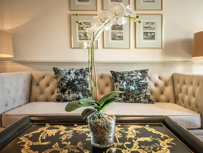 a living room with a couch and a table at The Black Lion, Long Melford in Long Melford
