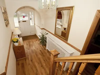 a staircase in a home with a mirror and a hallway at Rosa's Bed and Breakfast in Cambridge