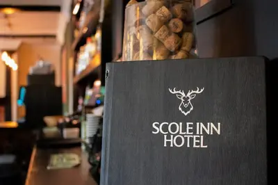 a sign for a scolinian hotel in a store at The Scole Hotel in Scole