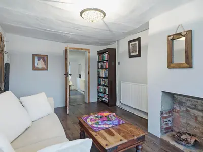a living room with a couch and a fireplace at Horseshoe House - Ukc2743 in Watton