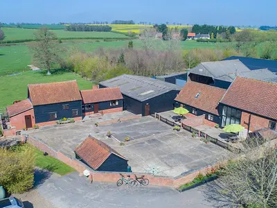 an overhead view of a building with a parking lot at Henry's Barn - Ukc3168 in Walpole