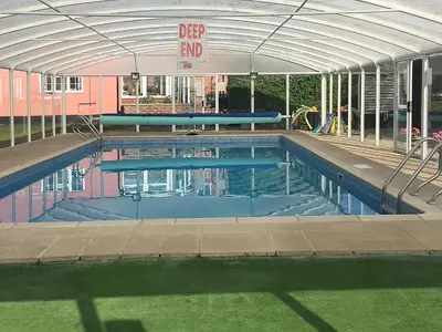 an empty swimming pool with an open canopy at Old Corn Mill - Ukc3170 in Walpole