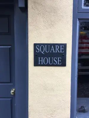 a sign that says square house on the side of a building at Square House Bildeston High street in Ipswich