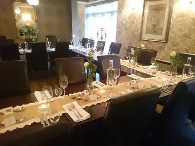 a conference room with a long table with glasses at Satis House Hotel in Yoxford