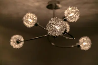 a close up of a chandelier with crystals at Modern & Exquisite Trumpington Townhouse with Parking & 5 mins to Papworth hospital in Cambridge