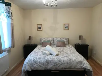 a bedroom with a bed with two pillows on it at Stay 69G - Hush View House, Romford, London Havering in Romford