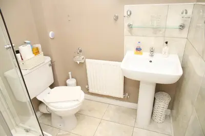a bathroom with a toilet and a sink at Stay 69G - Hush View House, Romford, London Havering in Romford