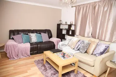 a living room with a couch and a coffee table at Stay 69G - Hush View House, Romford, London Havering in Romford
