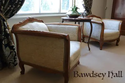 two chairs and a table in a room at Bawdsey Hall in Bawdsey