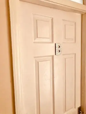 a white door with the letter b on it at AC Lounge 125 in Rochford
