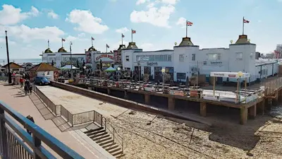 a train station with many buildings and flags at The Langtry Hotel in Clacton-on-Sea