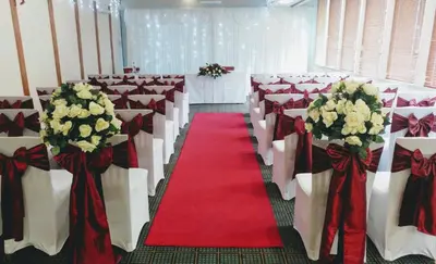 a room with rows of chairs and a red carpet at Holiday Inn Ipswich by IHG in Ipswich