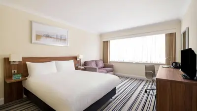 a hotel room with a bed and a television at Holiday Inn Ipswich by IHG in Ipswich