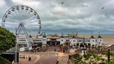 a ferris wheel at a beach with a carnival at Holiday Inn Colchester by IHG in Colchester