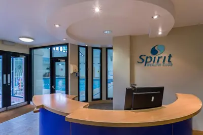an office with a split stationery sign on the wall at Holiday Inn Cambridge by IHG in Cambridge