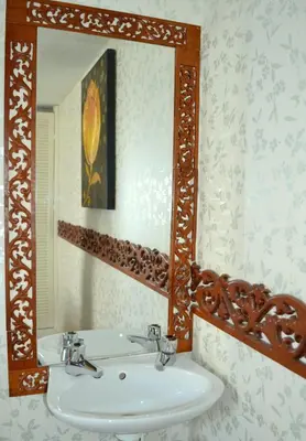 a bathroom with a white sink and a mirror at Ely Guest House in Ely