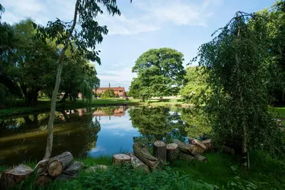 a view of a pond in a park at Seckford Hall Hotel & Spa in Woodbridge
