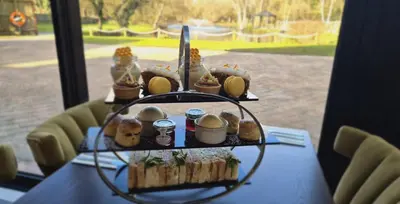 a table with a bunch of food on it at Great Hallingbury Manor & Lodges London Stansted in Bishops Stortford