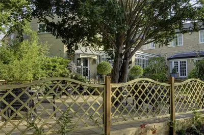a wooden fence in front of a house at Ivy Hill Hotel, BW Signature Collection in Chelmsford