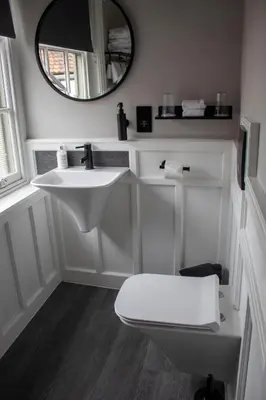a bathroom with a white sink and a mirror at J.D.Young in Harleston