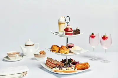 a tray of desserts and pastries on a table at Delta Hotels by Marriott Waltham Abbey in Waltham Abbey