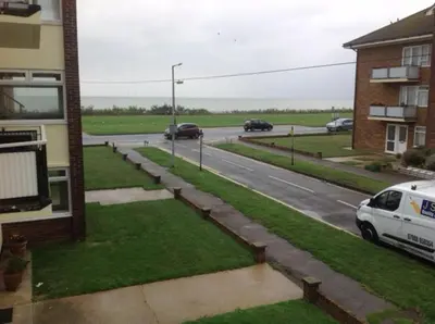a street with cars driving down a road at 9 Gunfleet court in Clacton-on-Sea
