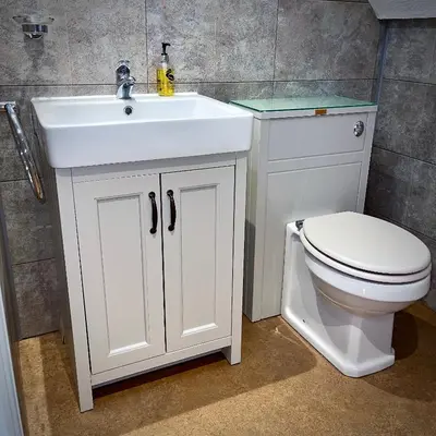 a bathroom with a white sink and a toilet at Sibton White Horse Inn in Saxmundham