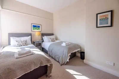 a bedroom with two beds in a room at Hillcrest, Aldeburgh in Aldeburgh