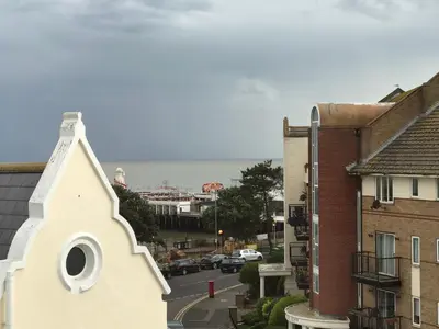 a view of a street with buildings and a church at Greyfriars in Clacton-on-Sea