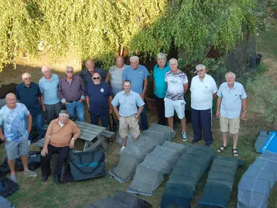 a group of people posing for a picture in the grass at Strenneth in Fersfield