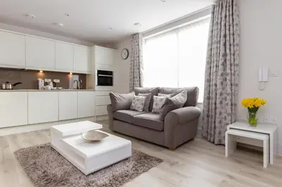 a living room with a couch and a table at Citystay Living - Midsummer Mews in Cambridge