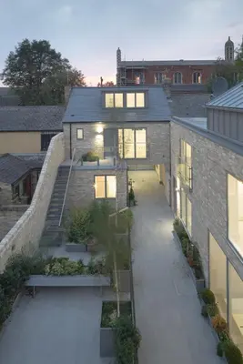 an external view of a brick building with a courtyard at Citystay Living - Midsummer Mews in Cambridge