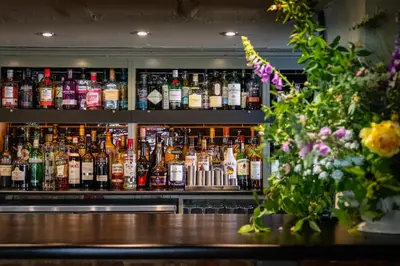 a bar with a lot of bottles of alcohol at The Cricketers Clavering in Clavering
