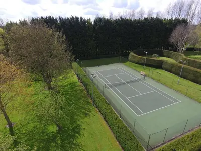 an overhead view of a tennis court in a park at Hockwold Hall in Hockwold cum Wilton