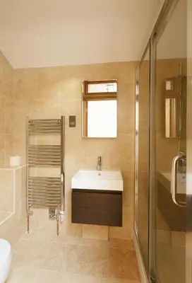 a bathroom with a sink and a shower at Owl's Hoot in Thorndon