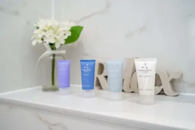 a shelf with a group of differentiatingiatesiatesiatesktop at Tailored Stays - Central Cambridge Studios, Free Parking in Cambridge