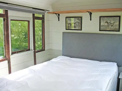 a bedroom with a white bed and two windows at Italian Carriage-Ukc3492 in Wetheringsett
