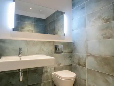 a bathroom with a sink and a toilet at Robin's Egg in Aldeburgh