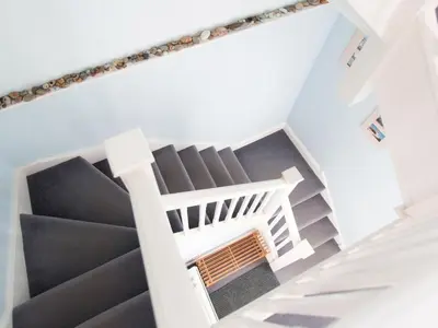 an overhead view of a staircase in a house at 1 Bell Lodge, Thorpeness in Thorpeness