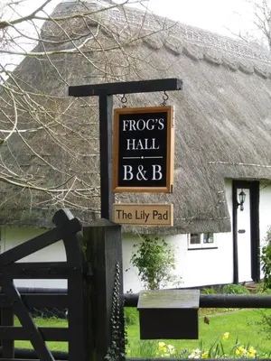 a sign that says frogs hall b the lily pad at Frogs Hall B&B in Eye