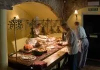 a group of people in a kitchen preparing food at Swan Hotel in Harleston