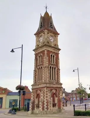 a clock tower in the middle of a street at The Courtyard in Newmarket