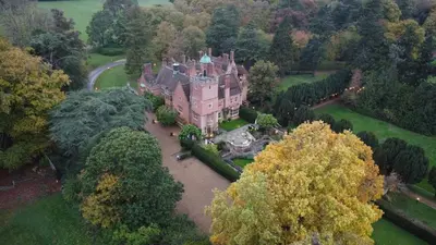 an aerial view of a large house with trees at Beautiful Country House Apartment in Newmarket