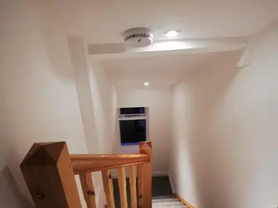 a room with a staircase with a light on the ceiling at 200m To Botanical Garden 3 Bedroom Victoria House in Cambridge