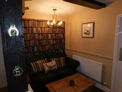 a living room with a couch and a coffee table at The Nags Head in Norwich
