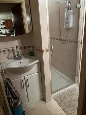 a bathroom with a sink and a shower at 2 bedrooms Bell Cottage in Hoddesdon