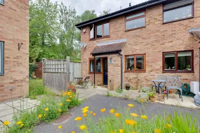 a brick house with a garden in front of it at Fully refurbished 1 bedroom in Cambridge