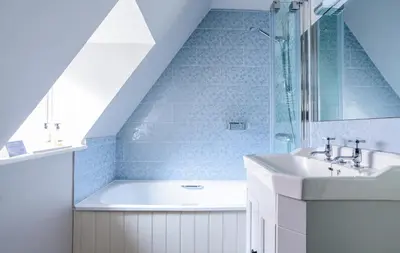 a bathroom with a bath tub and a sink at The Cross Keys, Aldeburgh in Aldeburgh